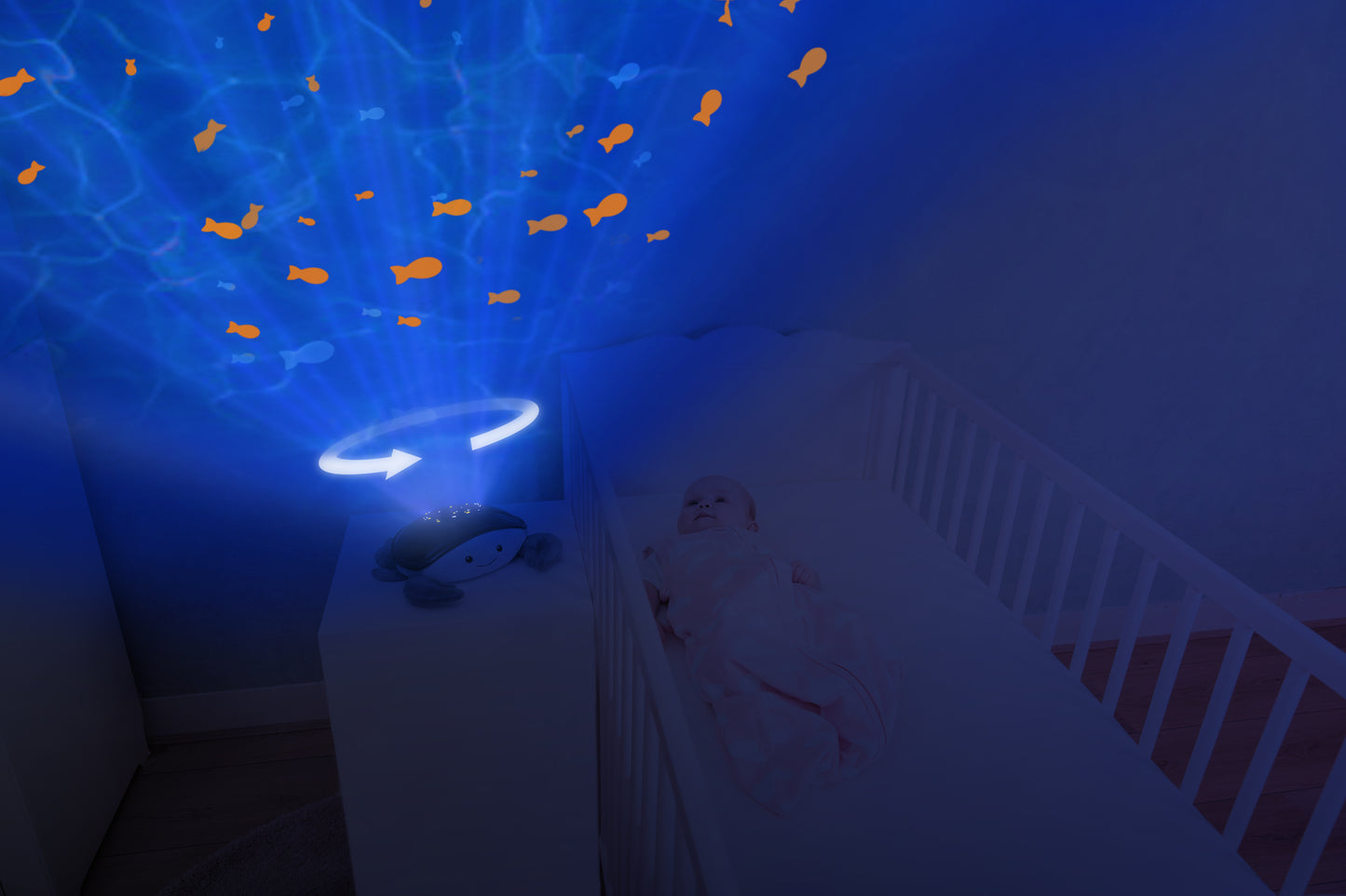 A teal and white crab shaped projector, sitting on a bedside locker displaying night light colours, while the baby rests in their cot.