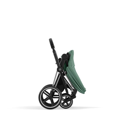 Cybex Priam chrome chassis with black handle and leaf green seat pack.