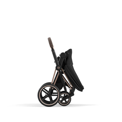 Cybex Priam rose gold chassis with dark brown handle and sepia black seat pack.