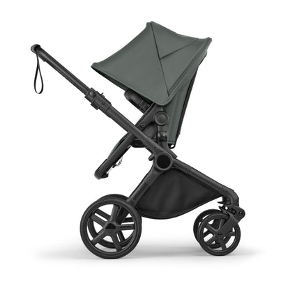 Bugaboo Cub stroller and carrycot in forest green with black chassis.