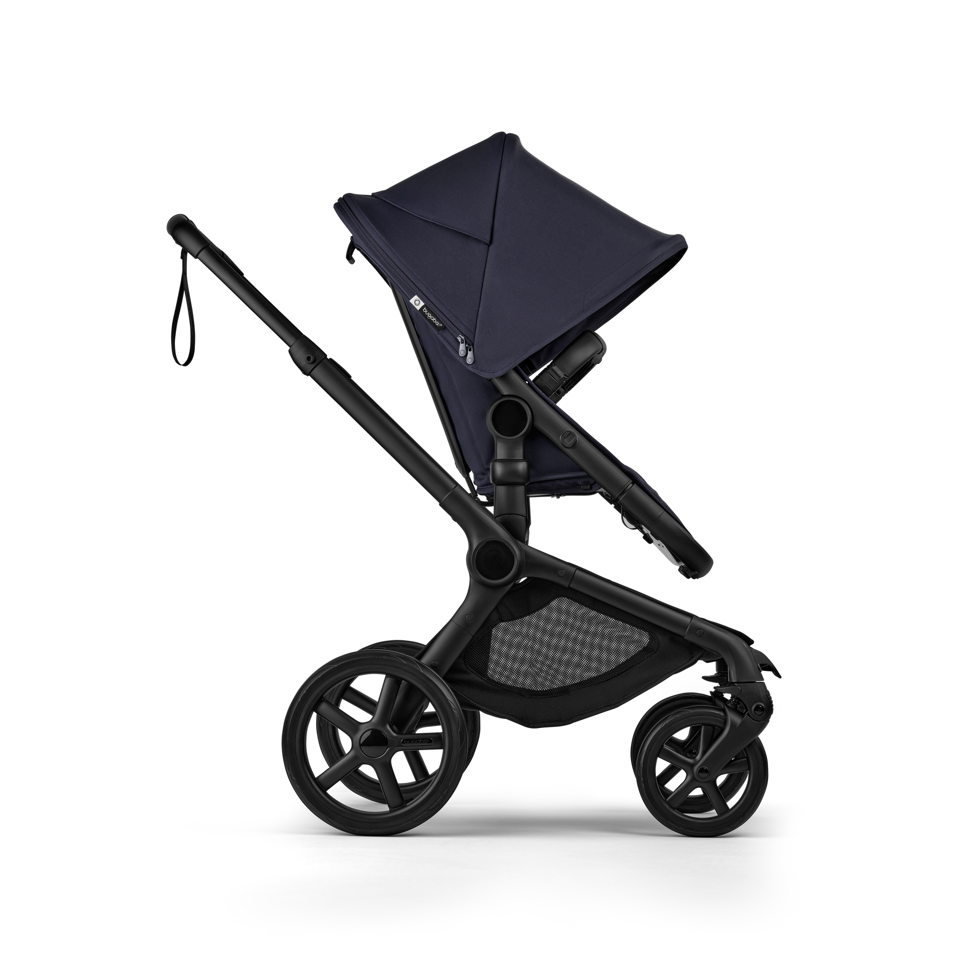 The deep indigo Bugaboo Fox5 pushchair, equipped with a seat and carrycot fabric, offers a compact fold for all-terrain use.