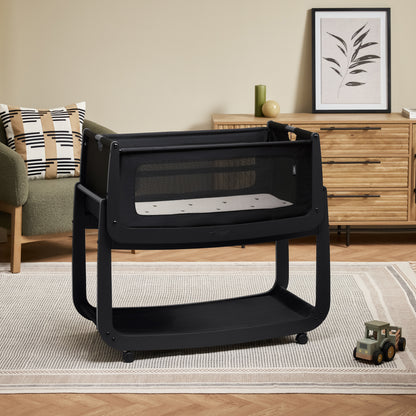 A Graphite Snuzpod5 bedside crib designed for infants, showcasing a modern and safe sleeping environment.