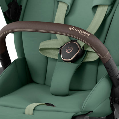 Cybex Priam rose gold chassis with bdark brown handle and leaf green seat pack.