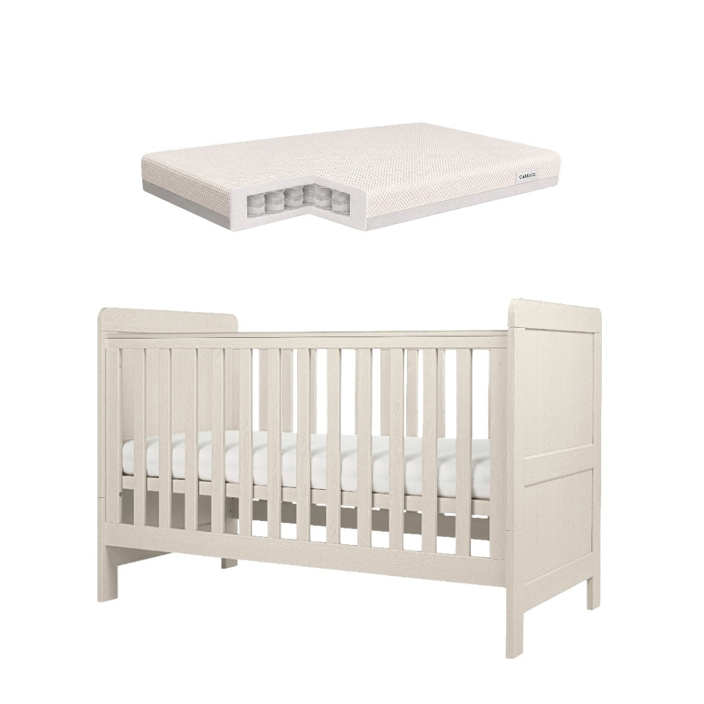Cot bed with adjustable heights in stone colour, complete with CuddleCo signature pocket spring mattress.