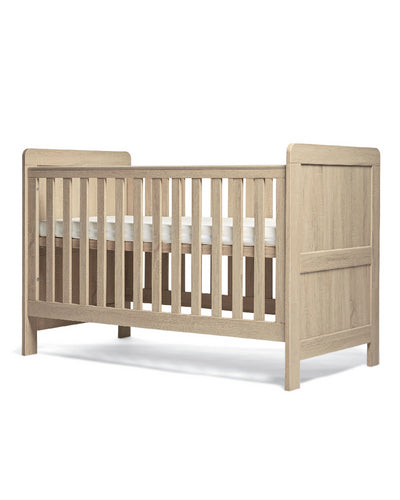 Mamas & Papas Atlas Cot Bed featuring a light oak design.