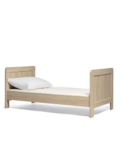 Mamas & Papas Atlas Cot Bed featuring a light oak design.