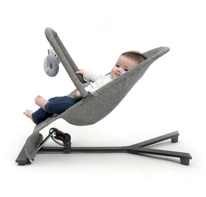 Stylish baby bouncer in grey melange, equipped with a three-position recline and a toy bar for playful engagement.