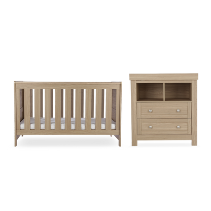 CuddleCo Burford 2 piece nursery furniuter set in an oak finish. Mattress not included.