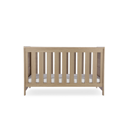 CuddleCo Burford cot bed in an oak finish. Mattress not included.