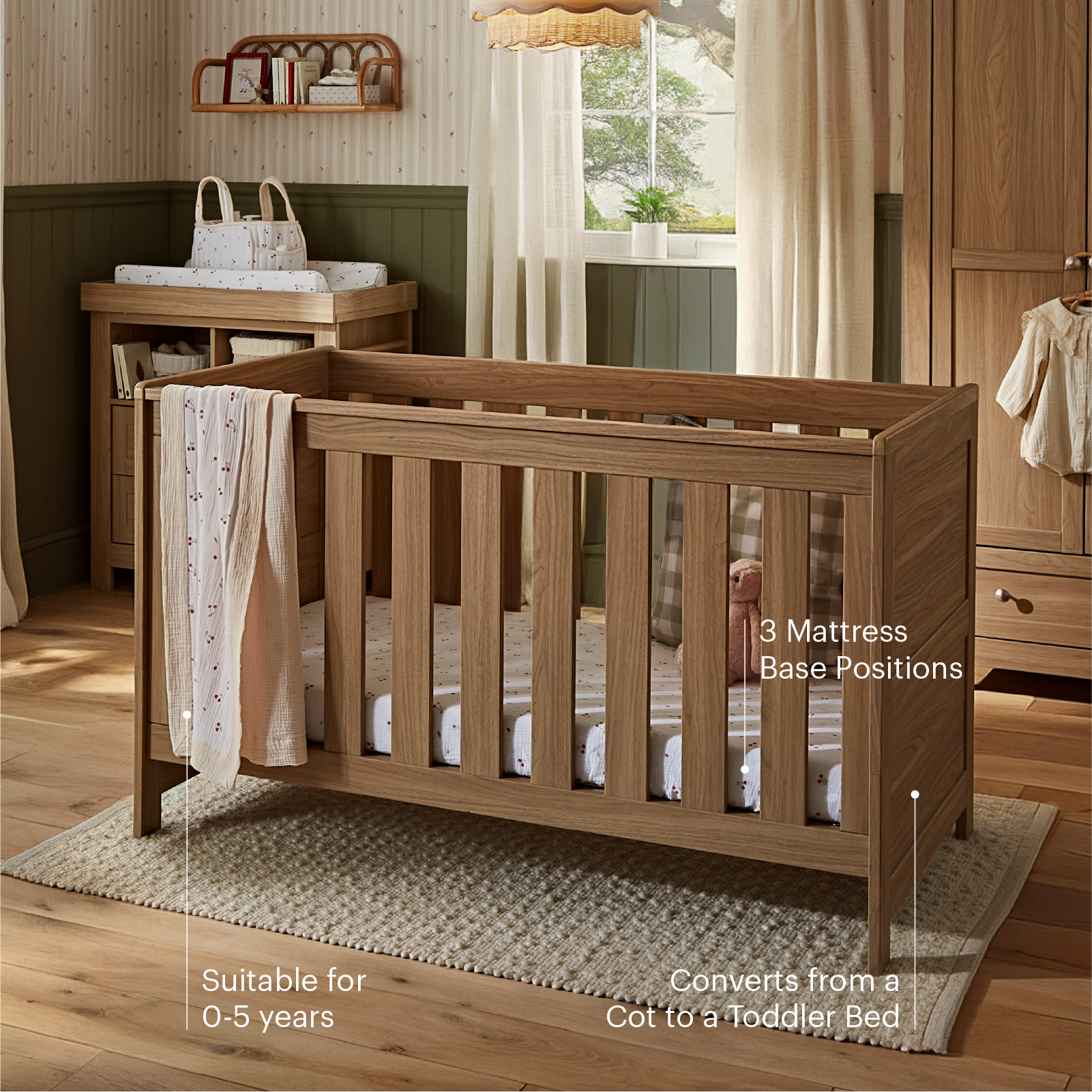CuddleCo Burford cot bed in an oak finish.
