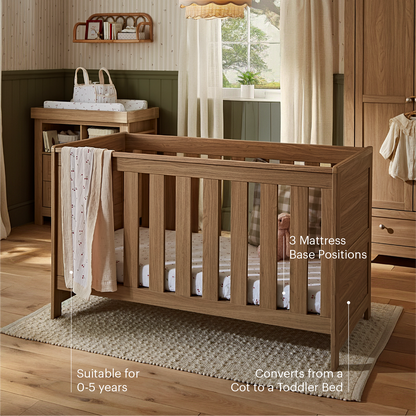 CuddleCo Burford cot bed in an oak finish.