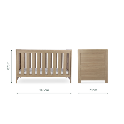 CuddleCo Burford cot bed in an oak finish.