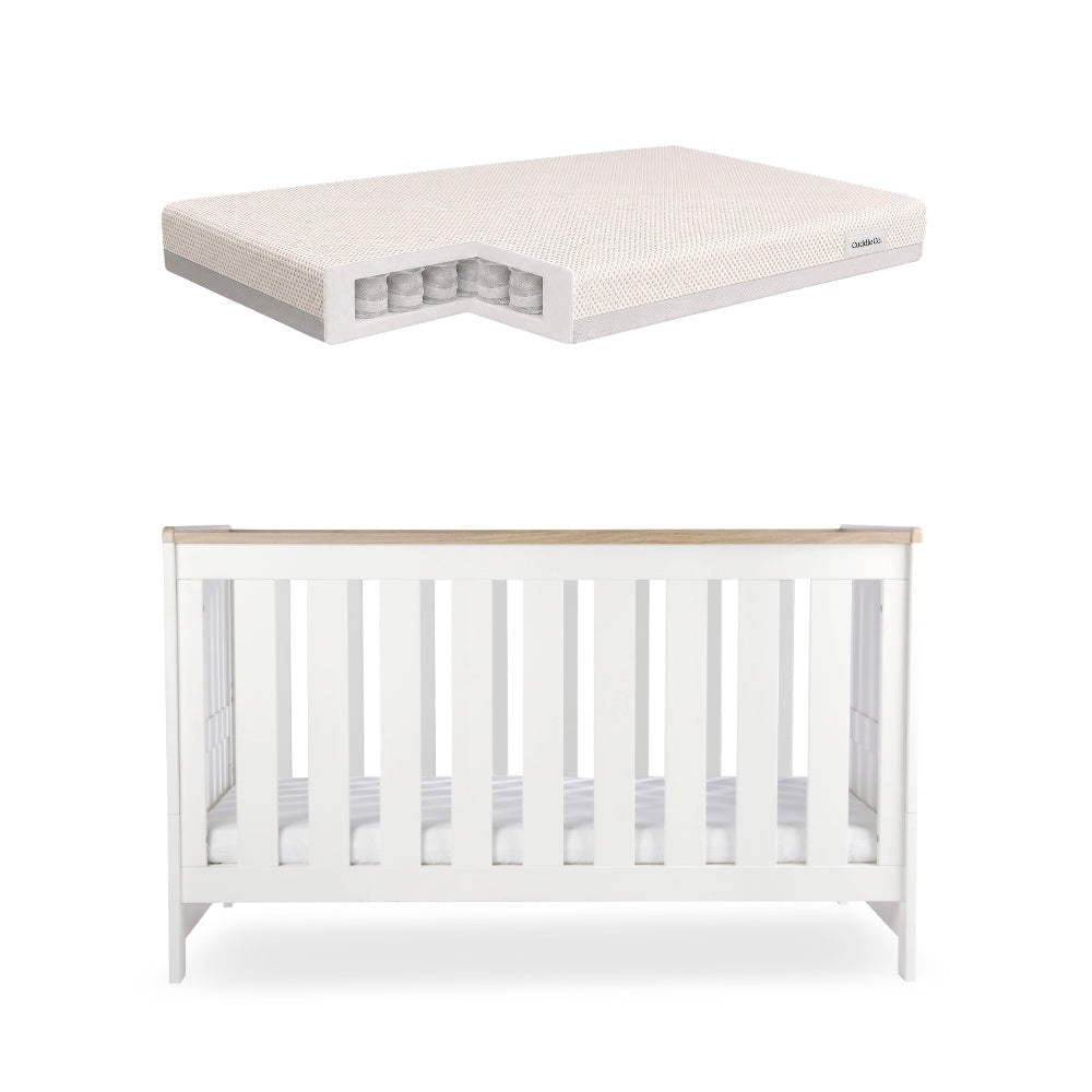 CuddleCo Burford cot bed in white with oak trim, with CuddleCo signature pocke sprung mattress.