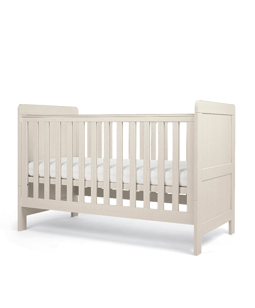 Cot bed and dresser with 3 drawers in stone colour, complete with lullaby mattress.