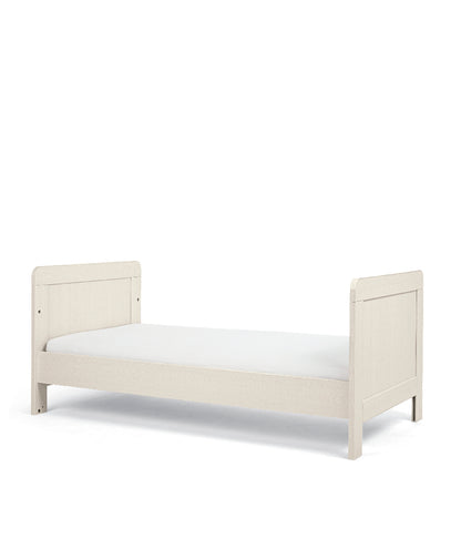 Cot bed with adjustable heights in stone colour, complete with lullaby mattress.