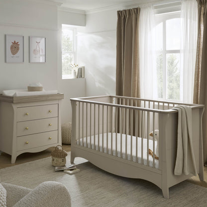 clara cashmere cot bed and dresser within a nursery