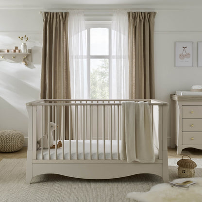 Clara cotbed in cashmere within a nursery