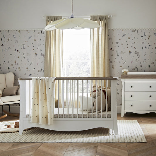 clara cot bed and dresser within a nursery