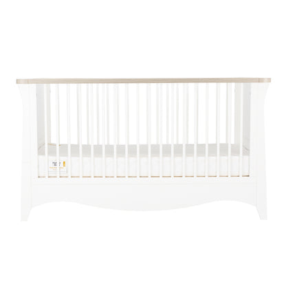 Clara cot bed featuring a white and ash design 