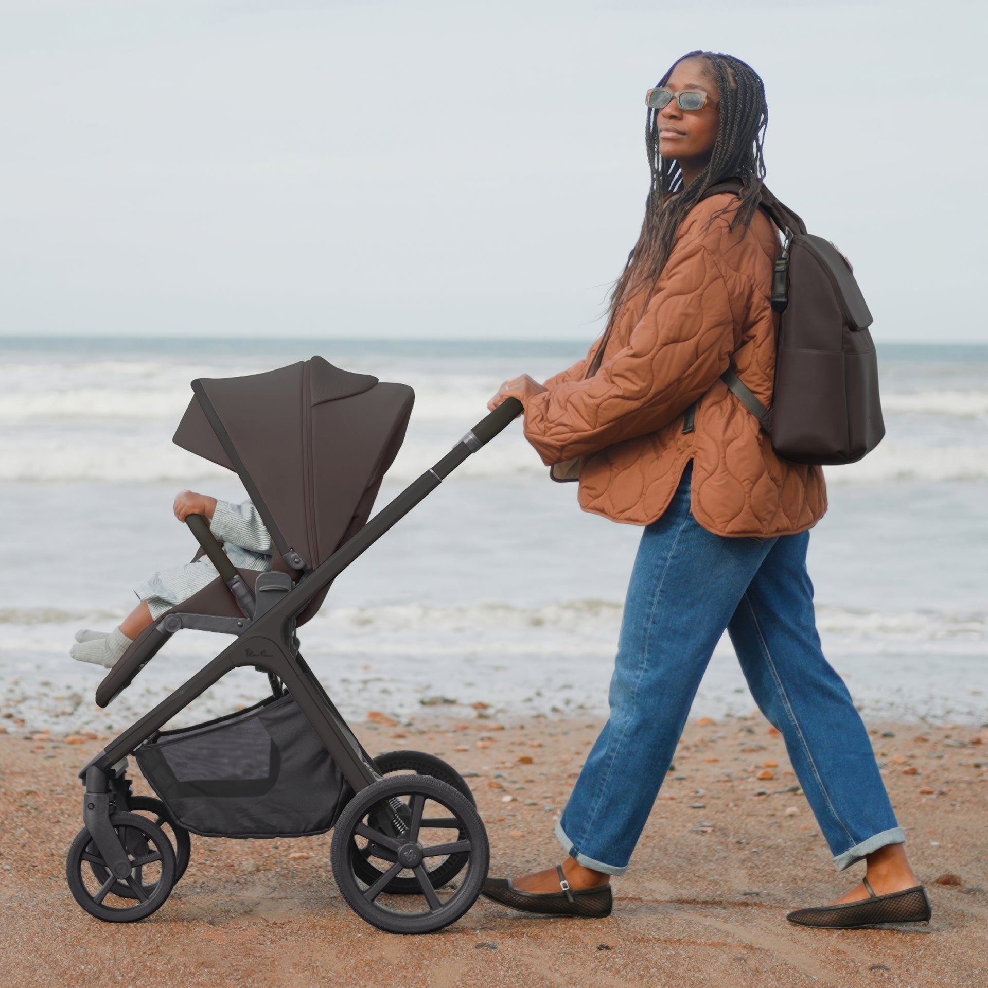 Silver cross cove 2 travel system in chocolate brown with next stage car seat in black.