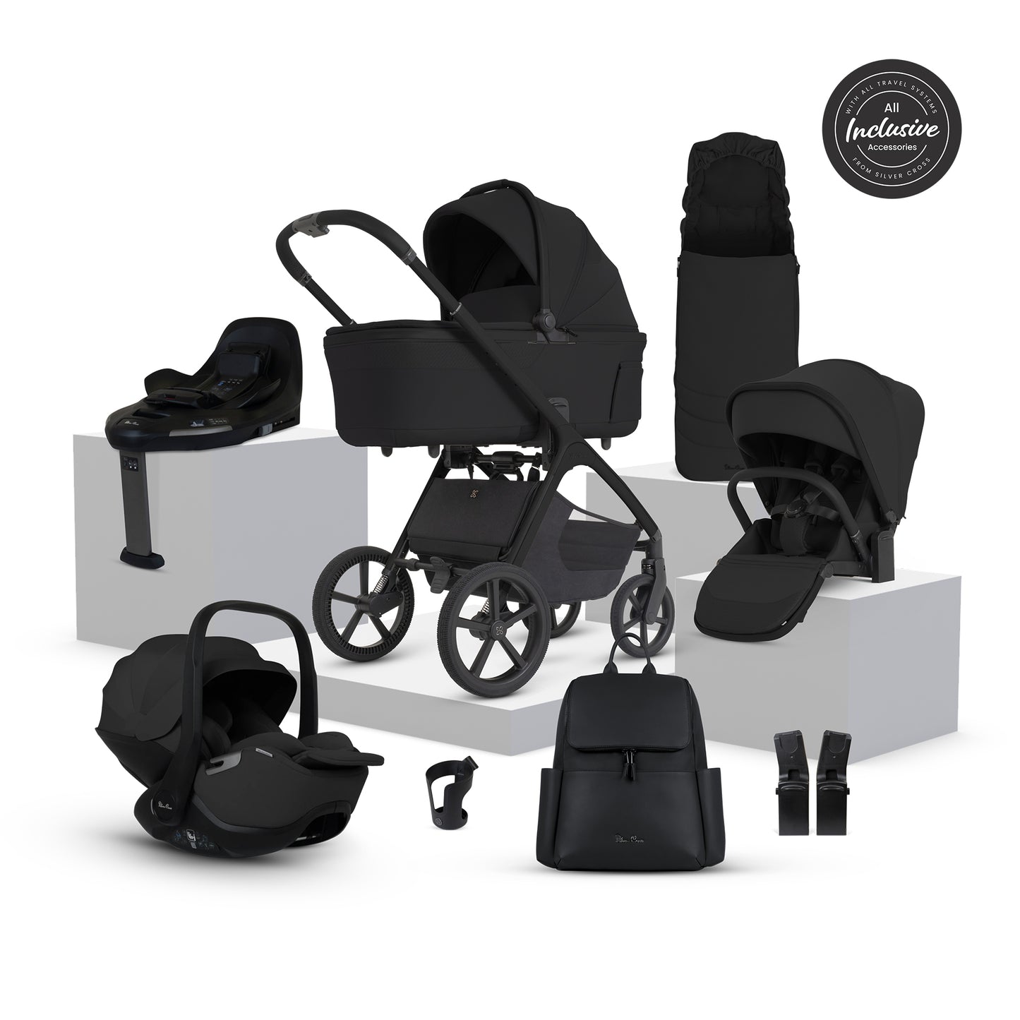 A multi-piece silver cross cove 2 travel system in matte black, displayed on white pedestals against a white background. The set includes a stroller, bassinet, car seat in black, infant seat, footmuff, backpack, and accessories, with an 'All Inclusive' badge in the top right corner.