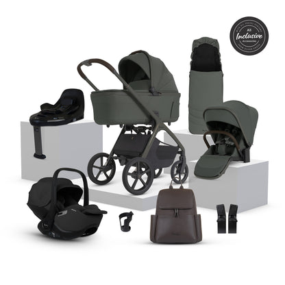 A multi-item silver cross cove 2 travel system set in dark olive green and black, displayed on white pedestals against a white background. The set includes a stroller, bassinet, car seat in black, infant seat, travel system cover, bassinet bag, car seat liner, and a brown backpack.