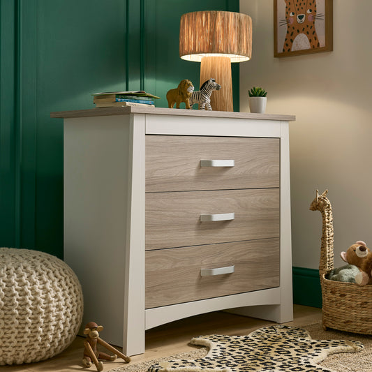 Ada 3 drawer dresser with toys and a light