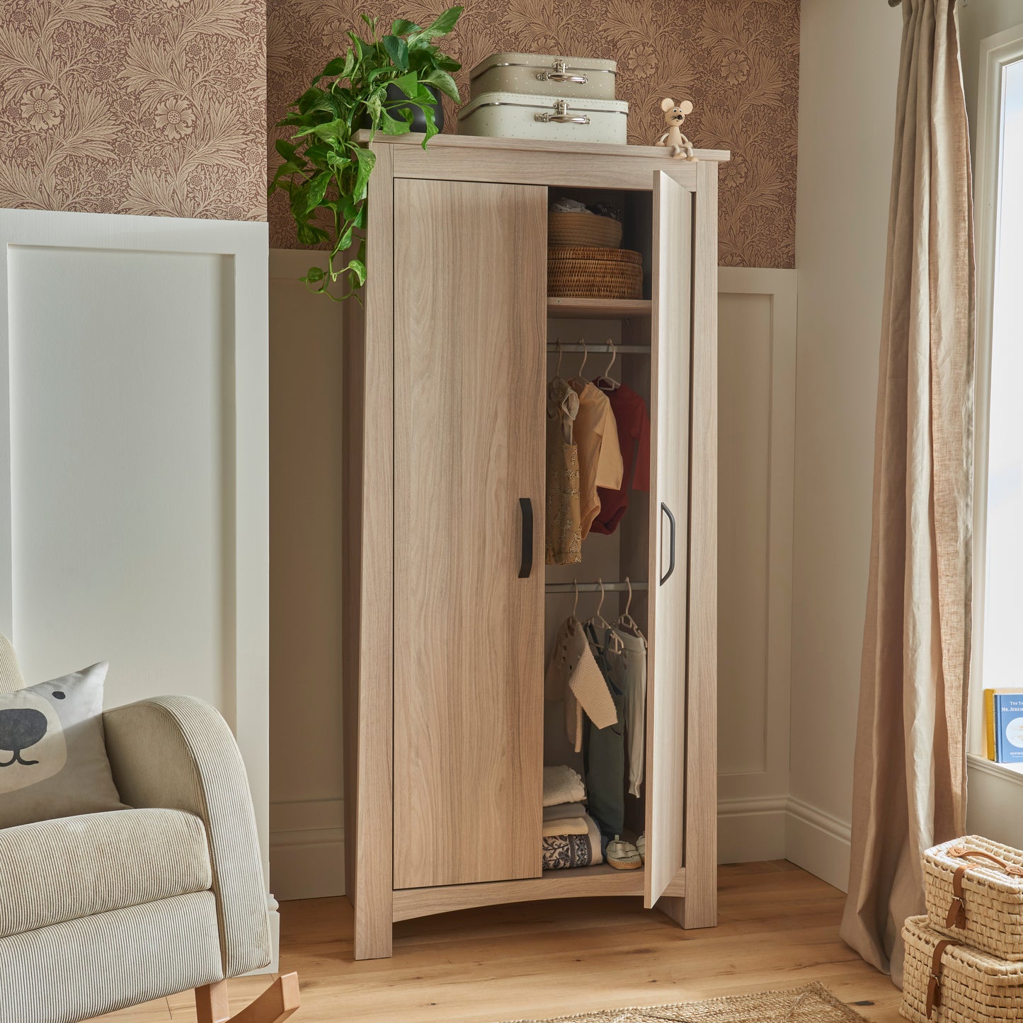 An Isla wardrobe made of ash is a beautiful addition to a nursery. 