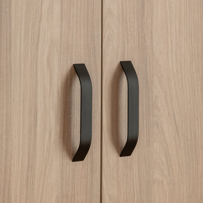 Close-up image of an Isla wardrobe with black handles.