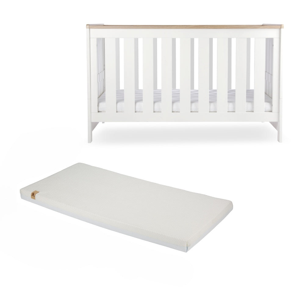 CuddleCo Burford cot bed in white with oak trim, with lullaby mattress.