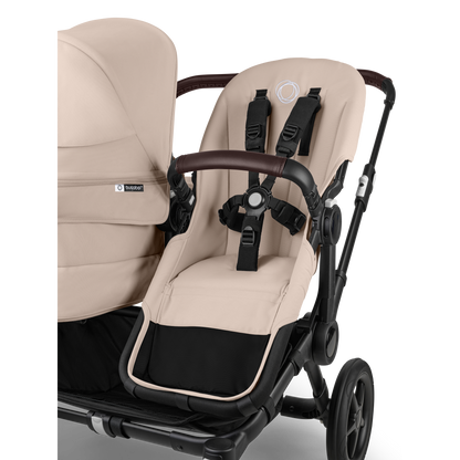 Desert Taupe Bugaboo Donkey 5 stroller with 2 x seat and 1 x carrycot fabrics, designed for easy folding and adaptable for mono, duo or twin configurations.