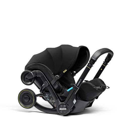 A stylish Doona car seat in nitro black, for a modern infant safety solution.