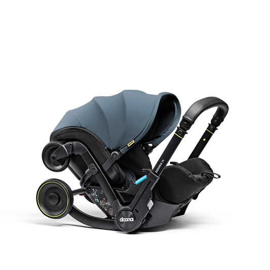 A stylish Doona car seat in Ocean Blue, for a modern infant safety solution.