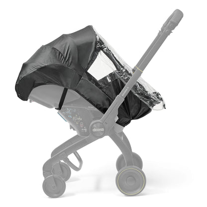 A black stroller  car seat with a clear protective cover, specifically designed for use with a Doona car seat in rainy conditions.