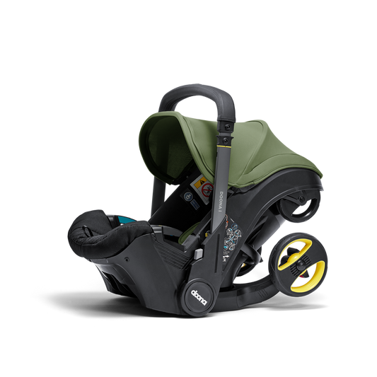 A stylish Doona car seat in Desert Green, for a modern infant safety solution.