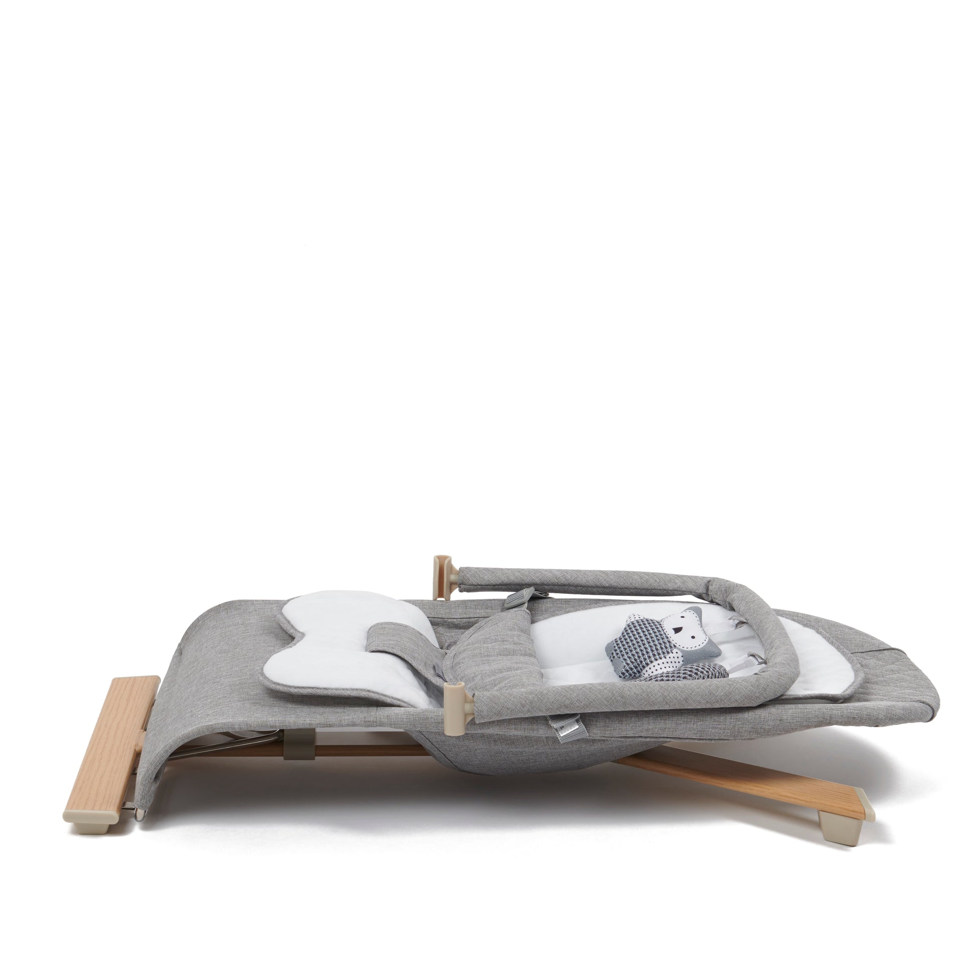 Stylish baby bouncer in grey and white, equipped with a three-position recline and a toy bar for playful engagement.