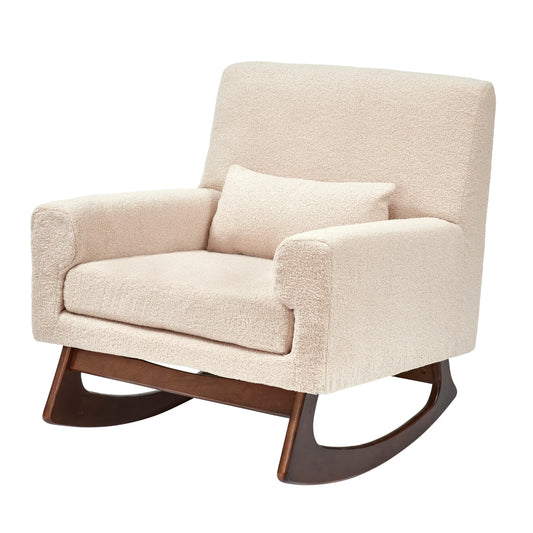 Fabric rocking chair featuring a lumbar cushion and low arms, designed for comfort while feeding a baby.