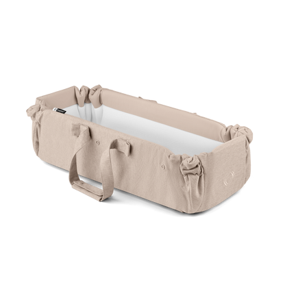 Bugaboo baby nest in desert taupe colourway to fit inside various pushchairs.