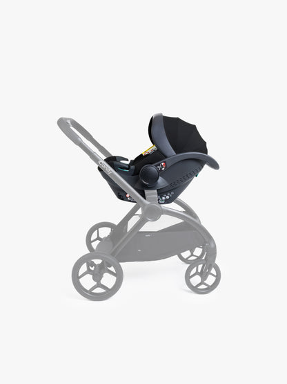 Black baby car seat with base and ISOFIX connector on a white background
