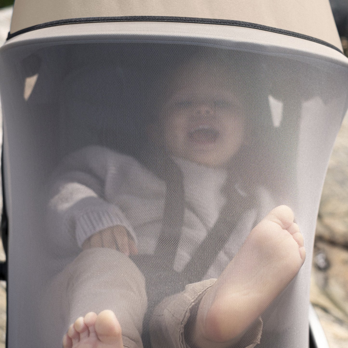 STOKKE YOYO insect net shown on a stroller with seat pack.