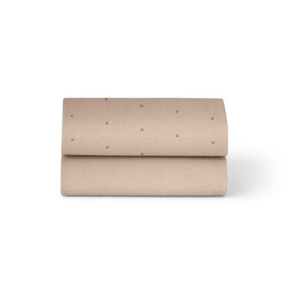 Snuzpod crib sheets in mocha brown with cross colour.