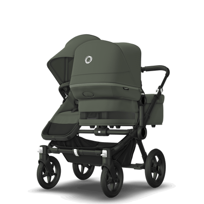 Forest Green Bugaboo Donkey 5 stroller with 2 x seat and1 x carrycot fabrics, designed for easy folding and adaptable for mono, duo or twin configurations.