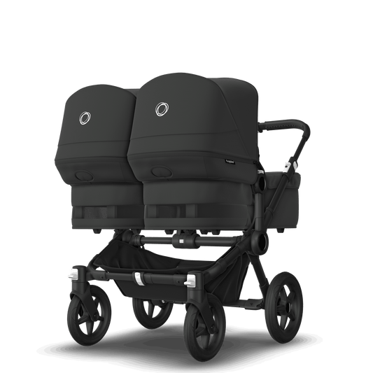 Midnight Black Bugaboo Donkey 5 stroller with 2 x seat and 2 x carrycot fabrics, designed for easy folding and adaptable for mono, duo or twin configurations.