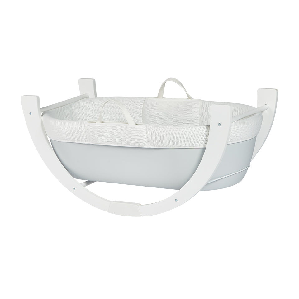 Dreamy moses basket in Grey resting on stand