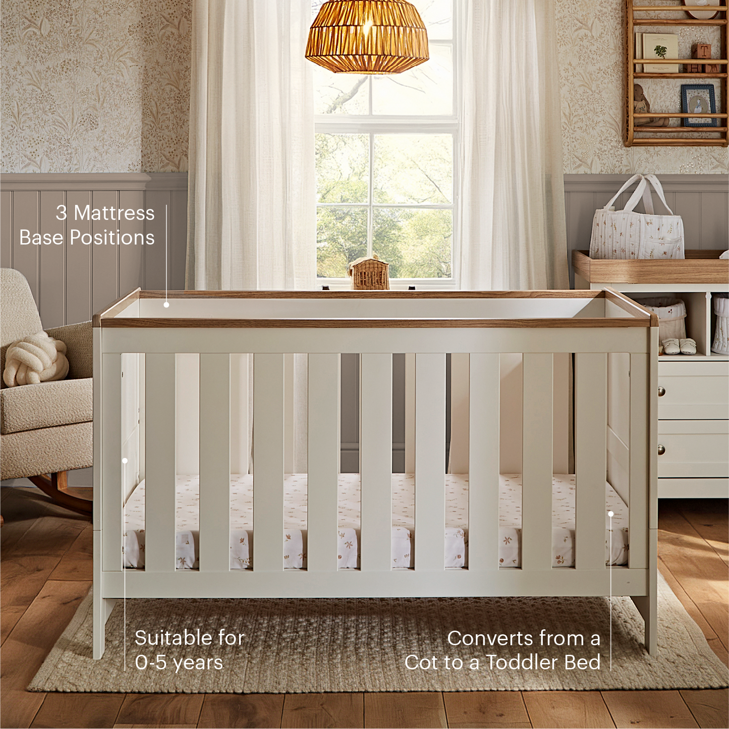 CuddleCo Burford cot bed in white with oak trim.