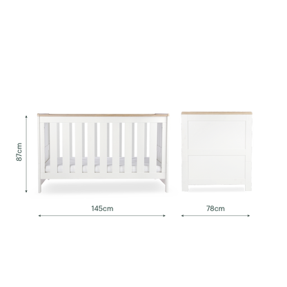 CuddleCo Burford cot bed in white with oak trim.