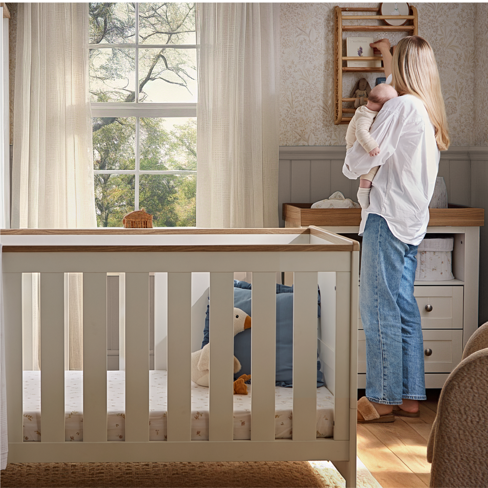 CuddleCo Burford cot bed in white with oak trim.