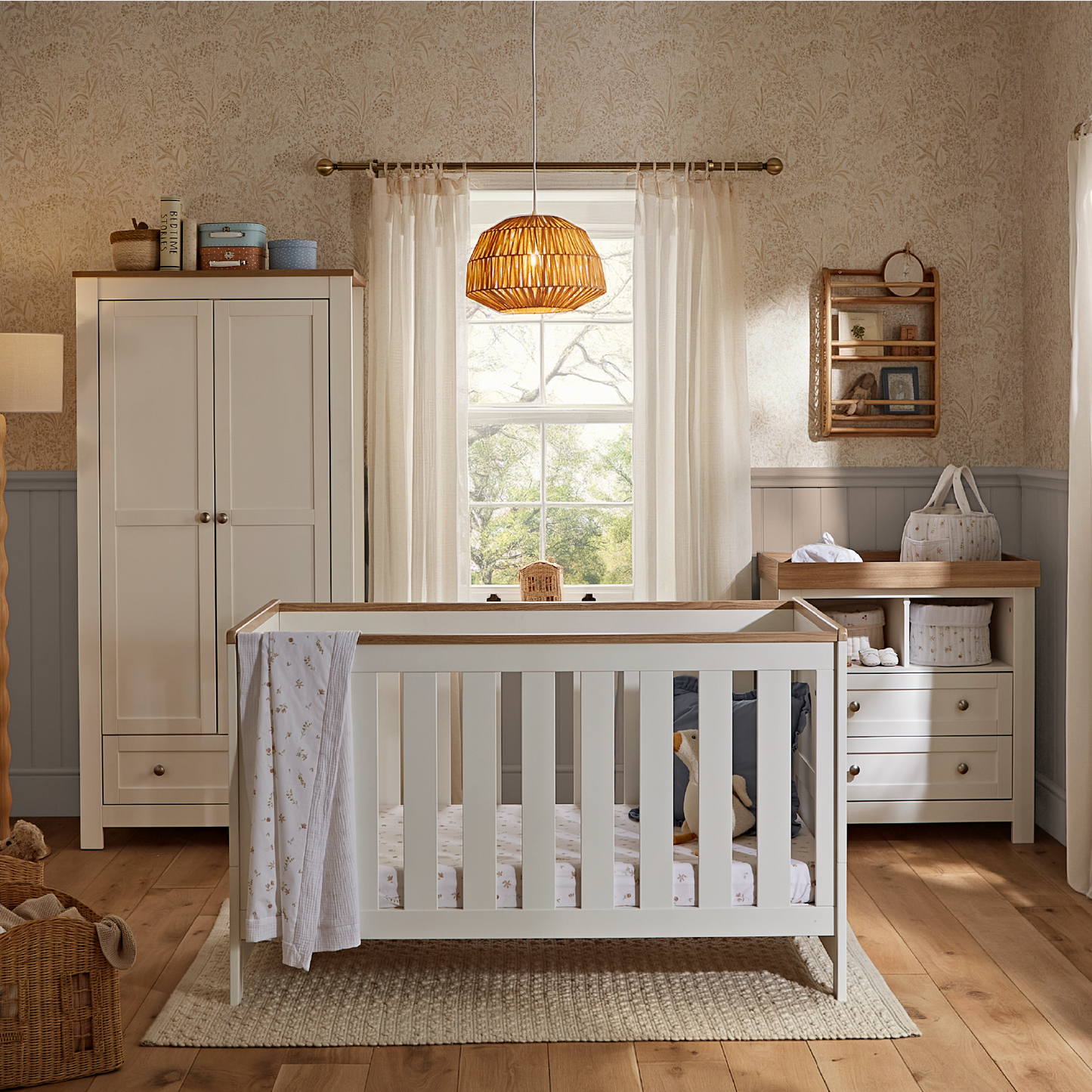 CuddleCo Burford 3 piece nursery furniture set in white with oak trim. 