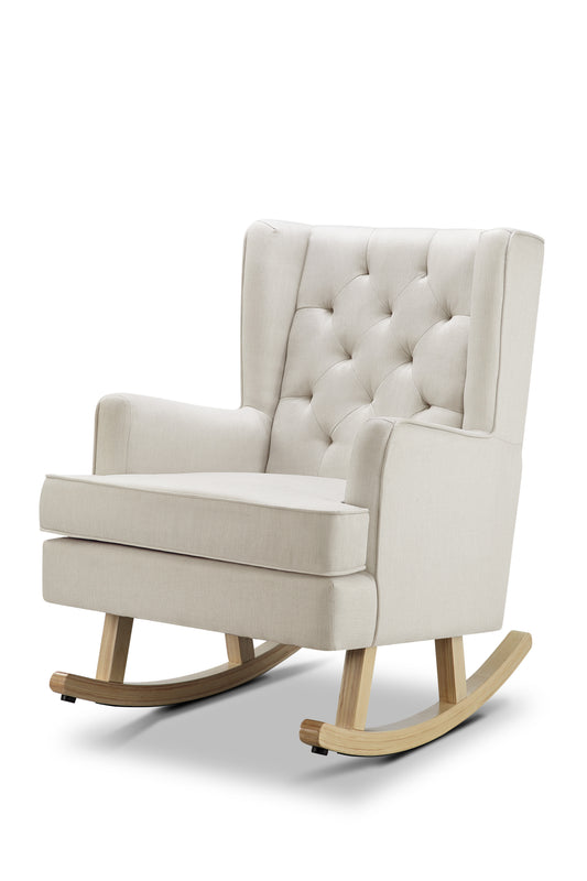 A high back natural rocking chair upholstered fabric, featuring a tufted back and sturdy hardwood legs.