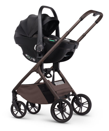 Tila 13 piece pram bundle with tiago car seat, isofix base and accessories in noce brown colourway.
